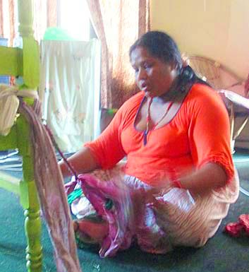 Maya making dog leashes from vintage saris